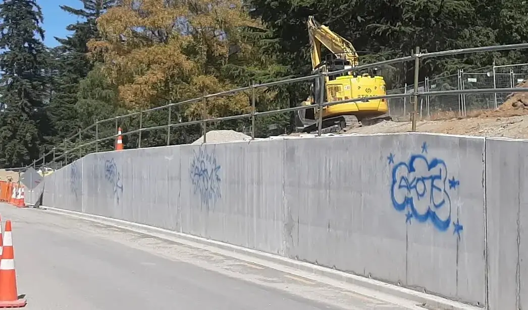 Wall surface with graffiti vandalism before professional removal in Queenstown
